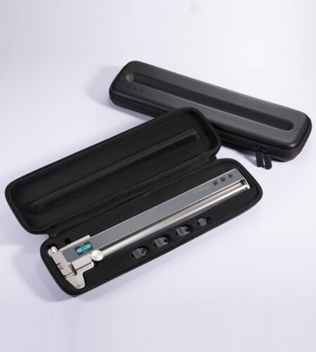 The image shows a digital caliper and its carrying case. The caliper is silver with a digital display and is placed inside a black, hard-shell case with a zippered closure. The case has a foam insert that snugly fits the caliper, ensuring it is secure during transport. The caliper has a long, straight body with a digital readout and a sliding mechanism for precise measurements. There are also several interchangeable anvil tips visible, which are used for different measurement tasks. The case is designed to protect the caliper from damage and is portable, making it convenient for fieldwork or travel.