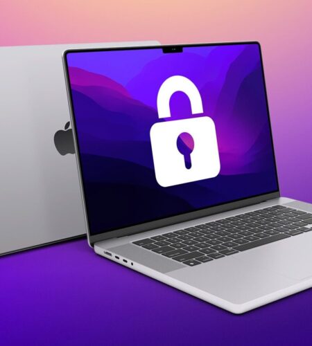 Two silver laptops are displayed at an angle against a purple and pink gradient background. One laptop is closed, showing only the silver exterior with the Apple logo centered on the lid. The other laptop is open, revealing a black keyboard and a white screen with a large, white padlock icon prominently displayed in the center. The laptops appear to be modern models with thin bezels and sleek designs. The light source creates soft shadows beneath both laptops, emphasizing their form.